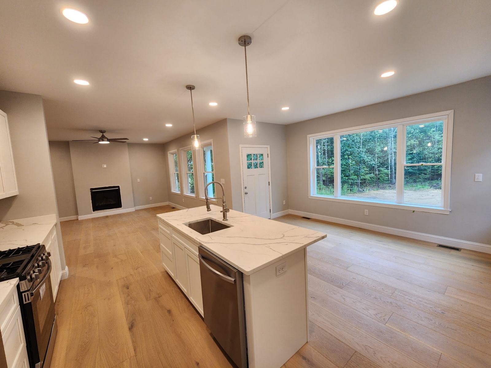 Kitchen island with a view of the woods